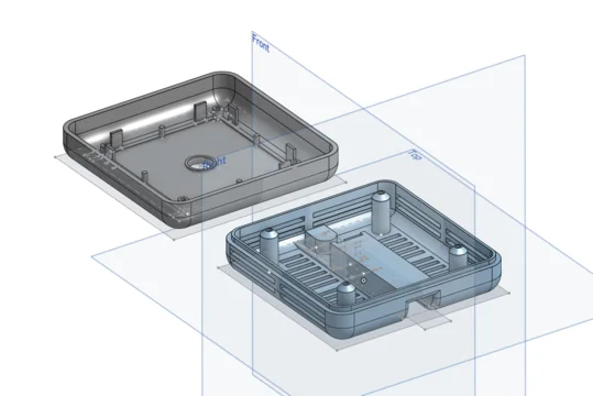 Transparent 3D CAD view of the two-part detector enclosure with mounting points and component openings.
